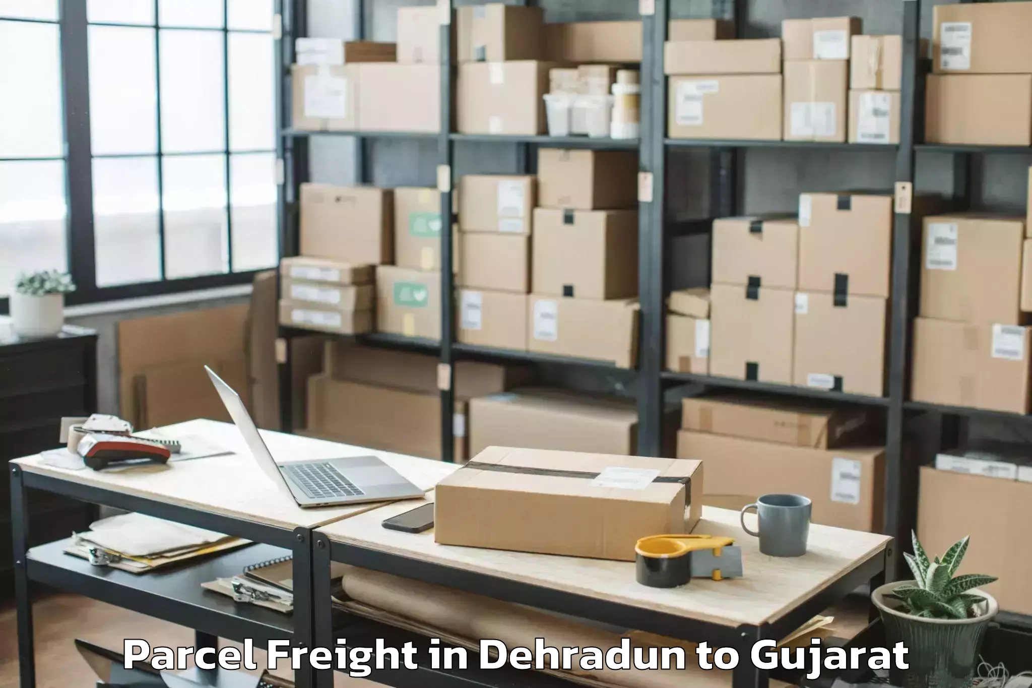 Discover Dehradun to Una Gir Somnath Parcel Freight